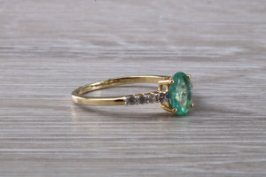 Dainty Oval cut Emerald and Diamond set Yellow Gold Ring