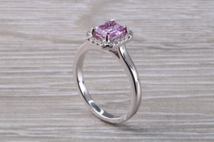 One carat Pink Sapphire and Diamond Halo set Ring