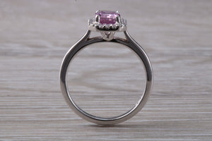 One carat Pink Sapphire and Diamond Halo set Ring