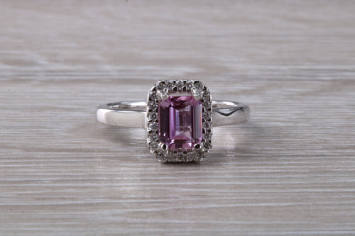 One carat Pink Sapphire and Diamond Halo set Ring