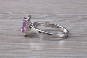 One carat Pink Sapphire and Diamond Halo set Ring
