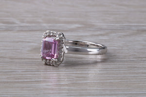 One carat Pink Sapphire and Diamond Halo set Ring