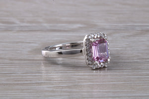 One carat Pink Sapphire and Diamond Halo set Ring