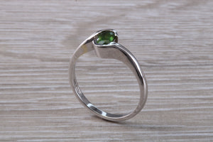 Oval cut Green Sapphire Crossover Ring