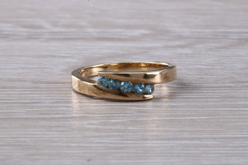 Sky Blue Topaz set Yellow Gold Twist Shank Ring