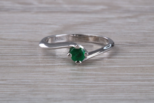 Half carat Round cut Emerald set Twist Solitaire