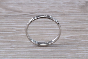 Platinum Diamond Band set with three Round cut Diamonds