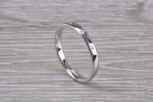 Platinum Diamond Band set with three Round cut Diamonds