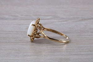 Oval cut Natural Opal set Yellow Gold Ring