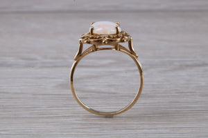 Oval cut Natural Opal set Yellow Gold Ring