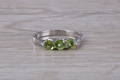 Round cut Peridot set 18ct White Gold Trilogy Ring