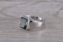 Load image into Gallery viewer, Emerald cut Mystic Topaz set Silver Ring
