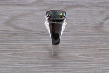 Load image into Gallery viewer, Emerald cut Mystic Topaz set Silver Ring
