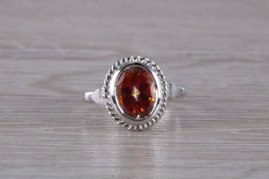 Oval cut Azotic Topaz set Ring