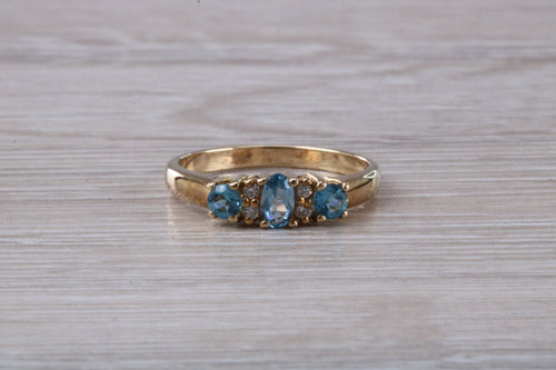 Sky Blue Topaz and Diamond set Yellow Gold Ring