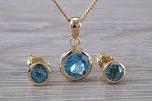 Load image into Gallery viewer, Round cut Blue Topaz Matching Earrings and Necklace set in Yellow Gold