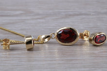 Load image into Gallery viewer, Oval cut Garnet Earrings and Matching Necklace set in Yellow Gold