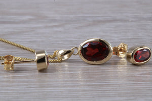 Oval cut Garnet Earrings and Matching Necklace set in Yellow Gold