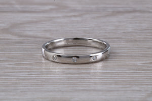 Platinum Diamond Band set with three Round cut Diamonds