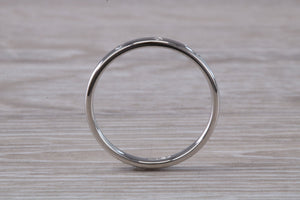 Platinum Diamond Band set with three Round cut Diamonds