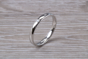 Platinum Diamond Band set with three Round cut Diamonds