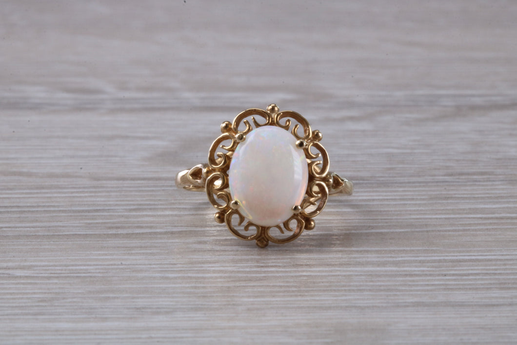 Oval cut Natural Opal set Yellow Gold Ring