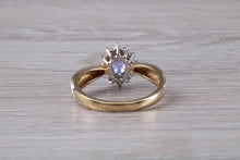 Load image into Gallery viewer, Tanzanite and Diamond Halo Ring