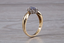 Load image into Gallery viewer, Tanzanite and Diamond Halo Ring