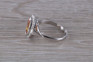 Oval cut Azotic Topaz set Ring