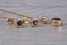 Load image into Gallery viewer, Round cut Garnet Earrings and Matching Necklace set in Yellow Gold