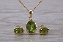 Load image into Gallery viewer, Oval cut Peridot Earrings and Matching Necklace set in Yellow Gold