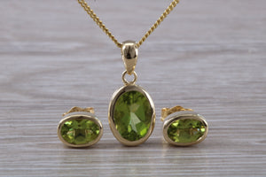 Oval cut Peridot Earrings and Matching Necklace set in Yellow Gold