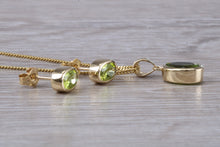 Load image into Gallery viewer, Oval cut Peridot Earrings and Matching Necklace set in Yellow Gold