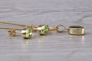 Oval cut Peridot Earrings and Matching Necklace set in Yellow Gold