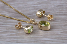 Load image into Gallery viewer, Oval cut Peridot Earrings and Matching Necklace set in Yellow Gold