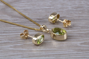 Oval cut Peridot Earrings and Matching Necklace set in Yellow Gold
