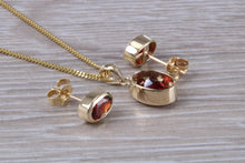 Load image into Gallery viewer, Oval cut Garnet Earrings and Matching Necklace set in Yellow Gold