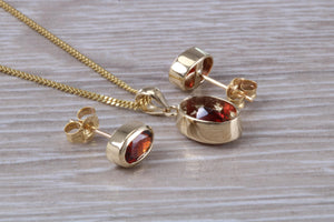 Oval cut Garnet Earrings and Matching Necklace set in Yellow Gold