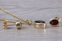 Load image into Gallery viewer, Oval cut Garnet Earrings and Matching Necklace set in Yellow Gold