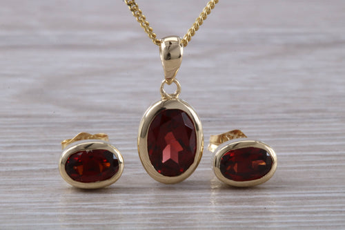 Oval cut Garnet Earrings and Matching Necklace set in Yellow Gold