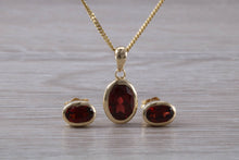 Load image into Gallery viewer, Oval cut Garnet Earrings and Matching Necklace set in Yellow Gold