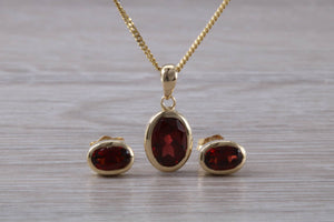 Oval cut Garnet Earrings and Matching Necklace set in Yellow Gold