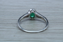 Load image into Gallery viewer, Emerald and Diamond Halo Ring