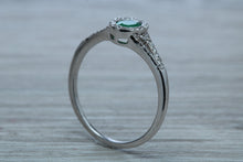 Load image into Gallery viewer, Emerald and Diamond Halo Ring