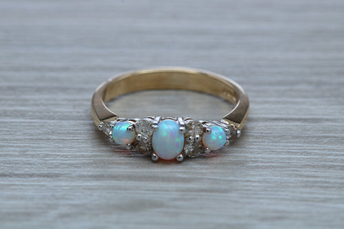 Fiery Opal and Diamonds set Yellow Gold Ring
