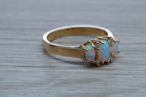 Fiery Opal and Diamonds set Yellow Gold Ring