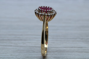 Oval cut Ruby and Diamond Cluster Ring