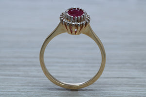 Oval cut Ruby and Diamond Cluster Ring