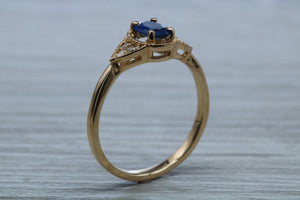 Oval cut Blue Sapphire and Diamond Ring