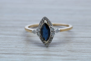 Marquise cut Halo set Blue Sapphire and Diamond Ring